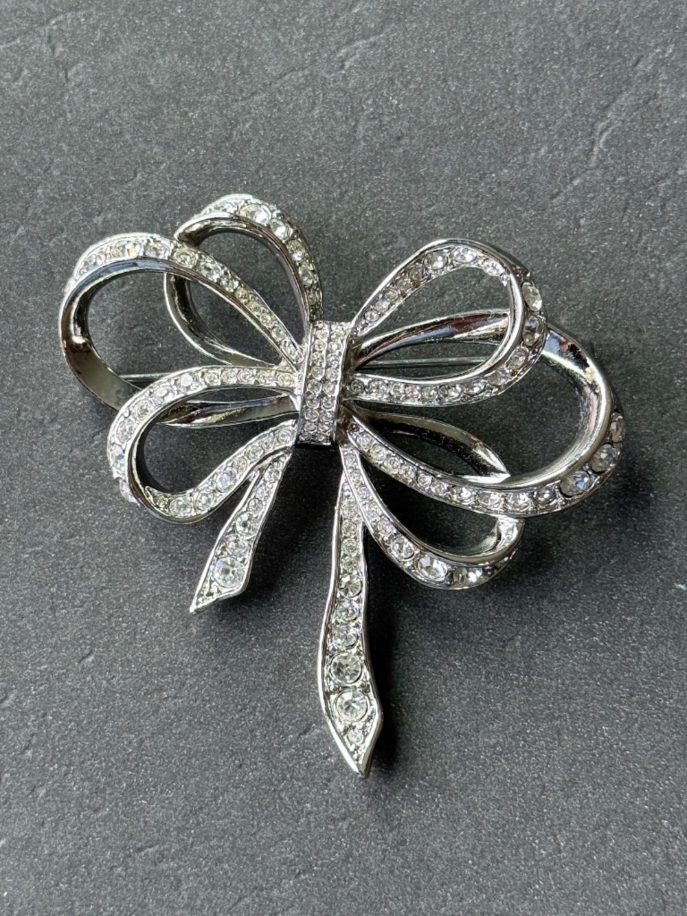 AVON by KJL Crystal Silver Loop Ribbon Bow Brooch